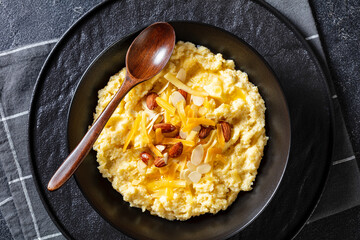 corn grits with butter, vegan cheese, and almonds
