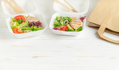  Lunch boxes with healthy food on white wooden background. Copy space.