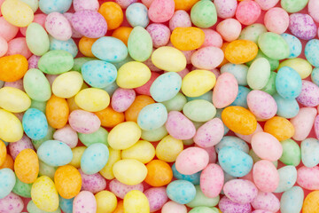 Fototapeta na wymiar Easter egg background of pastel color candy