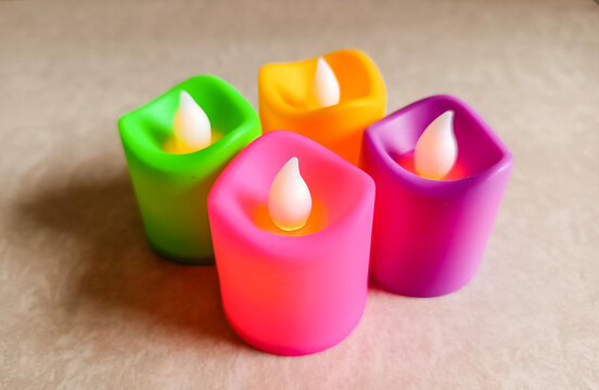 four candles of different color. Plastic candled are switched on and lit up gives a perfect beautiful feel of festival time like christmans and diwali 