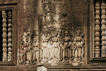 ancient frescoes and bas-reliefs of the angkor watt temple complex