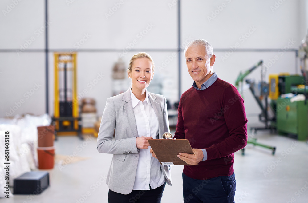 Aufkleber they make sure this place runs efficiently. portrait of two factory managers doing an inspection.