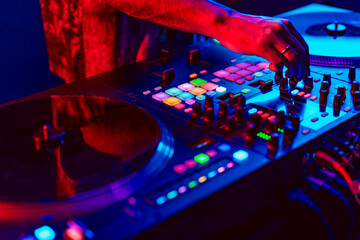 Close up of dj console mixer during concert in the club