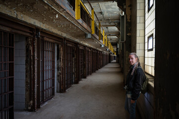 Smiling young girl visiting the cell galleries of the Old Joliet Prison