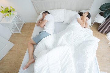 Man snoring in bed and make woman.