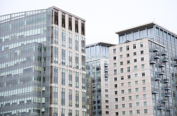 modern city contemporary building showing residential real estate with large window apartments with glass futuristic design depicting commercial workplace and corporation 