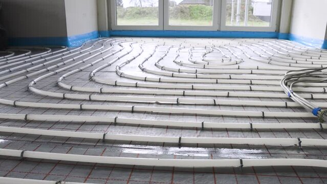 Layout of pipes for hydronic underfloor heating inside a building
