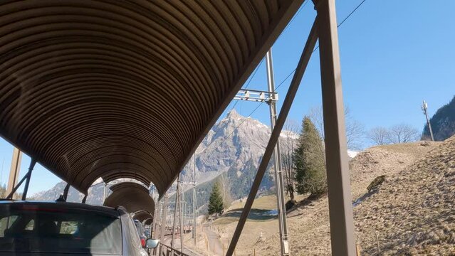Beautiful View of Mountain on Clear Day while Traveling on Lotschberg Car Train. Switzerland
