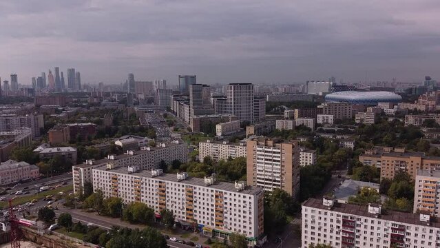 Aerial view of the sleeping district of Moscow against the background of the business center and the Dynamo stadium