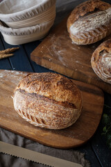 Artisan Batard Sourdough healthy Bread with leaf scoring. Open crumb high hydration Sourdough bread set on white table. - 581414125