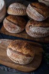 Artisan Batard Sourdough healthy Bread with leaf scoring. Open crumb high hydration Sourdough bread set on white table. - 581414129