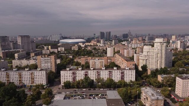 Aerial view of the sleeping district of Moscow against the background of the business center and the Dynamo stadium
