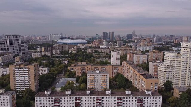 Aerial view of the sleeping district of Moscow against the background of the business center and the Dynamo stadium