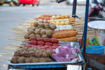 Various foods with sticks sold on the street in Bangkok