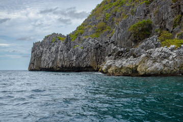 Rocky landscape with sea , mountains and trees