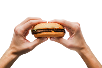 a man holds a burger in his hands on a transparent background close-up top view