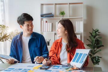 Obraz premium Creative male and women web designer planning application development for web mobile phone at modern workplace.