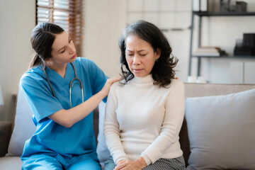 Female doctor touching patient's shoulder to encourage treatment.