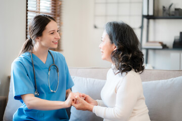Fototapeta premium Doctor's hand reassuring elderly patient.