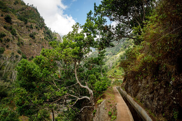 Irrigation canal in mountains, Levadas of Madeira island in the Atlantic Ocean.