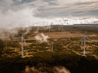 Windmills farm - wind generator turbines - on the top of a mountain.
