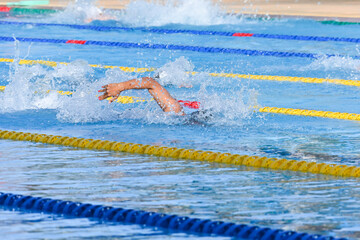 Sport man swimming in the pool at the sport complex.Professional Athlete Training for the Championship.Male Swimmer swimming in swimming pool.