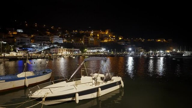 Night view of the coast with boats of the city of Agropoli in Italy.