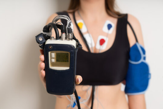 ECG sensors, electrocardiogram and blood pressure measurement. Woman with Holter