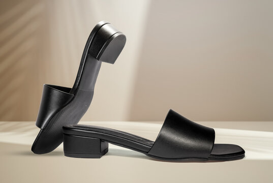 Creative Photo of Black Sandels for girls mockup psd modern shoe design, Seamless background