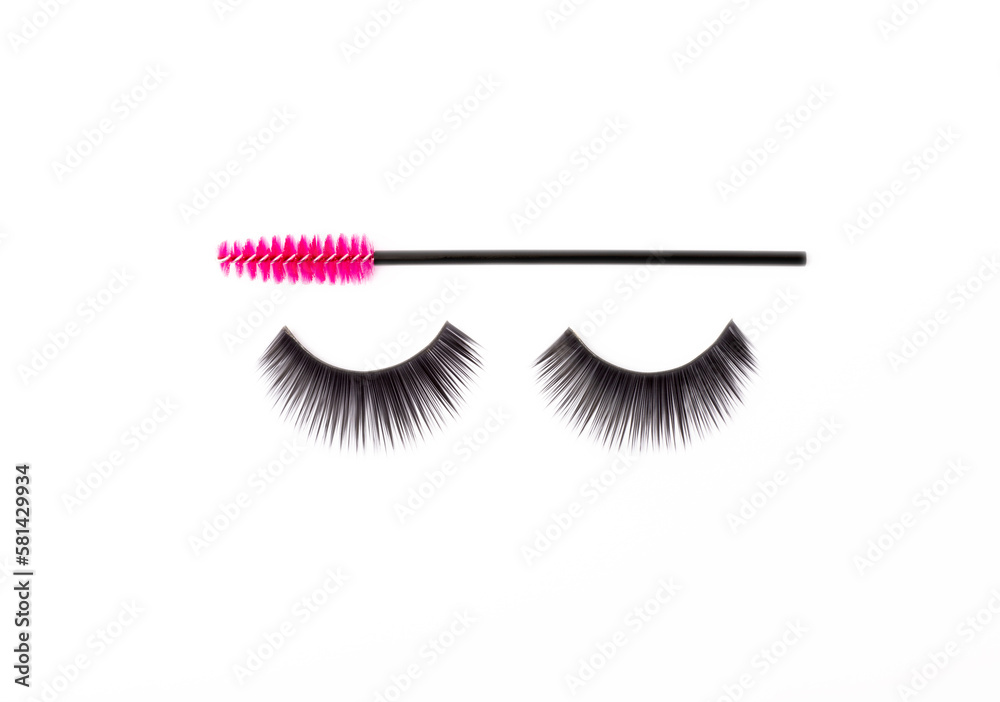 Wall mural Mascara brushes and false eyelashes isolated on white background. Makeup brushes makeup kits.Disposable brush for eyelashes and eyebrows.Close-up.