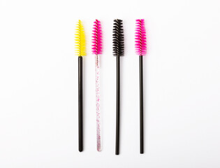 Mascara brushes isolated on white background. Makeup brushes makeup kits.Disposable brush for eyelashes and eyebrows.Close-up.