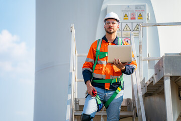 Wind turbine service engineer maintenance and plan for inspection at construction site, renewable electricity generator.
