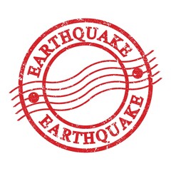 EARTHQUAKE, text written on red postal stamp.