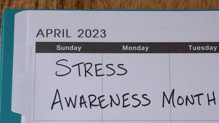 Stress Awareness Month written on a calendar in April 2023. April is National Stress Awareness Month to raise awareness of the negative impact of stress.  