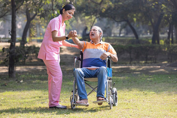 Senior man making physiotherapy session with young nurse.