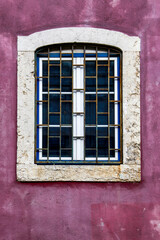 Colorful portuguese facade with white window
