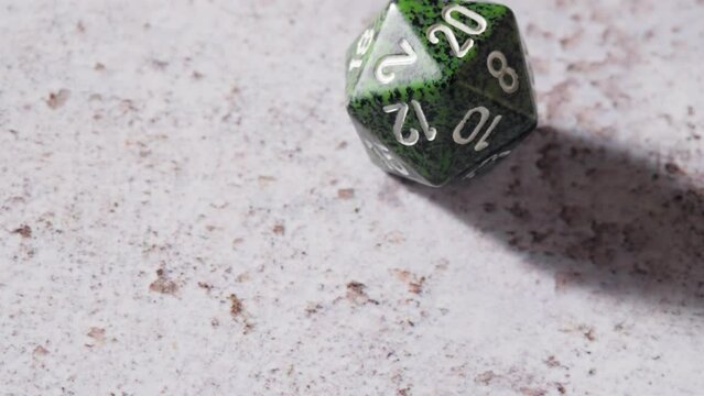 Green 20-sided dice is rolled for Table Top Roleplaying Game, Natural 20