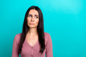 Photo of unsatisfied gloomy person look empty space sad sullen face isolated on turquoise color background - obrazy, fototapety, plakaty