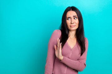 Photo of unsatisfied girl look arm palm deny reject empty space isolated on cyan color background - obrazy, fototapety, plakaty