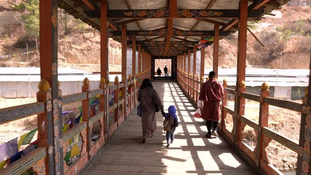 People walking on the bridge in Thimphu, Bhutan
