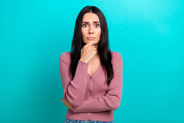 Portrait of impressed confused girl arm touch chin staring isolated on teal color background - obrazy, fototapety, plakaty