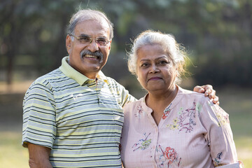 Portrait of indian senior couple at park.