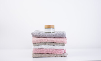 Fototapeta na wymiar set of multicolored bathroom towels isolated on white background. Hygiene items