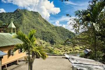 The majestic taal of Banaue in the Philippines with its rice terraces, tree-covered hills in the...