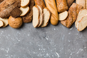 Homemade natural breads. Different kinds of fresh bread as background, top view with copy space