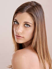 Fototapeta premium Beguiling beauty. Studio portrait of an attractive model gazing at the camera.
