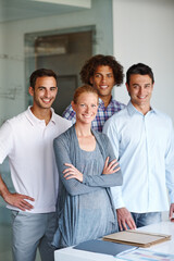 Approaching business with a smile. A group of casual business people standing together.