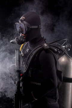 Spec ops police officer SWAT special forces  with a weapon in his hands. on a dark background. Law and order protection concept.  Poster concept for police, security or military