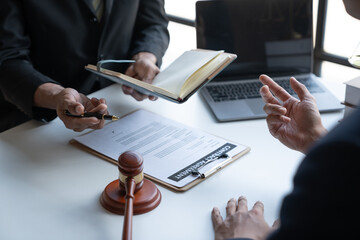 Private office of a young Asian lawyer working on financial information in a private bank. to verify financial accounts and assist clients.