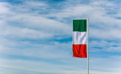 travel in italy.flag of italy on a flagpole.flag in the wind.Symbol of italy.Italian language.Travel agency.Symbol of the country.Warm country.holiday in italy.rag flag.country's national color